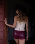 Embroidered knit corset
Adjustable halter tie neck
Front lace up closure
Back hook and eye and zipper closures
Fully lined
Studded details
Coachella outfit
Stagecoach outfit
Festival Outfit
