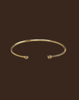 Gold cuff bracelet 
18k Gold Filled Open CZ Cuff Bracelet
60mm diameter - adjustable sizing
Hypoallergenic jewelry
Nickel Free
Water-resistant