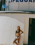 Crafted from sustainable Brazilian swim fabric
Skimpy coverage
Ruched scrunch band
black bikini bottom