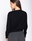 Knit long sleeve cardigan
Front button down closure
Ribbed crewneck neckline
Unlined
black cardigan