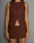 Houndstooth woven sleeveless top. Front button down closure. Front pockets. Fully lined. plaid vest top. plaid skirt set. fall outfit. winter outfit.
