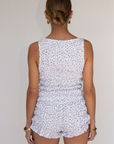 white Smocked floral printed shorts
Faux front bow
Elastic waistband
Has stretch
Unlined
summer shorts
