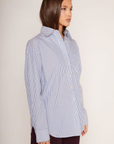 blue and white Striped oversized button down shirt
Collared
Front chest pocket
Long sleeve
Button down closure
Unlined