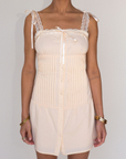 tan Woven coquette mini dress
Front bow detail
Front button closure
Adjustable lace and ribbon shoulder straps
Pintuck details on bodice
Smocked backing
Lined
summer mini dress
spring mini dress