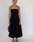 black Bubble halter maxi dress
Adjustable tie straps
Knit bodice
Woven skirt
Elastic neckline
Ruched sides
Side pockets
Fully lined