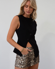 Animal printed denim skort. Side hook and eye and zipper closures. Side pockets. Shorts lining. leopard print skirt. leopard print skort. going out skort. fall outfit.