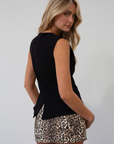 Animal printed denim skort. Side hook and eye and zipper closures. Side pockets. Shorts lining. leopard print skirt. leopard print skort. going out skort. fall outfit.