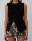 Animal printed denim skort. Side hook and eye and zipper closures. Side pockets. Shorts lining. leopard print skirt. leopard print skort. going out skort. fall outfit.