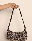 Leopard printed shoulder bag
Thin/rectangular shape with curved edges
Top zip closure with gold hardware
Adjustable, thin shoulder strap
leopard satin shoulder bag