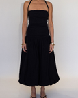 black Bubble halter maxi dress
Adjustable tie straps
Knit bodice
Woven skirt
Elastic neckline
Ruched sides
Side pockets
Fully lined