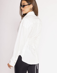 White Oversized button down long sleeve shirt
Button down closure
Lace up tie detail at back to adjust for a more fitted look
Unlined
