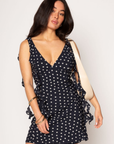 Polka dot chiffon mini dress. Adjustable straps. Back hook and eye and zipper closures. Fully lined. Ruffle trim. polka dot mini dress. summer dress. spring dress.