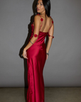 Satin maxi dress. Adjustable straps with rosette details. Side hook and eye and zipper closures. Unlined. red maxi dress. holiday look. holiday inspo. holiday outfit