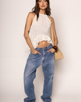 Woven halter top
Frilled trim
Adjustable neck tie
High to low trim
Unlined
cream boho top