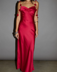 Satin maxi dress. Adjustable straps with rosette details. Side hook and eye and zipper closures. Unlined. red maxi dress. holiday look. holiday inspo. holiday outfit
