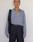Fuzzy heather crochet knit sweater. Henley quarter neckline with button down closures. Long sleeves. Unlined. brown pullover. grey sweater. fall sweater. fall outfit