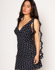 Polka dot chiffon mini dress. Adjustable straps. Back hook and eye and zipper closures. Fully lined. Ruffle trim. polka dot mini dress. summer dress. spring dress.