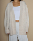 Fuzzy marled knit cardigan. Open front. Long sleeves. Front pockets. tan robe cardigan. cream robe cardigan. cute comfy outfit. cream cardigan. winter cardigan. fall cardigan