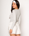 Ribbed knit top. Long sleeves. With elastic sleeve openings. Front button down closures. Unlined. Crochet lace trim. grey long sleeve
