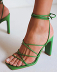 Vegan leather green lace up heel. Open square toe.
high shaved block heel
open square toe
thin flat toe strap
crossover over strappy upper
wrap around lace up ankle strap
exposed heel counter
synthetic upper, lining and outsole
Heel height 10.5cm.