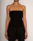 Strapless dress. Knit bodice. Woven skirt. Elastic neckline. Inner rubber grip lining. Side hook and eye and zipper closures. Unlined. Black mini dress. fall dress. holiday dress. friendsgiving dress. thanksgiving dress. summer dress. little black dress