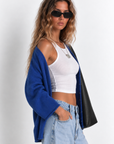 blue Fuzzy knit cardigan
Crewneck
Front button down closures
Long sleeves
Unlined
dodger blue sweater