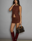 Houndstooth woven sleeveless top. Front button down closure. Front pockets. Fully lined. plaid vest top. plaid skirt set. fall outfit. winter outfit.