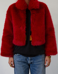 Faux fur coat. Collar neckline. Front zipper closure. Side pockets. Fully lined. red fur coat. fall coat. winter coat. red faux fur coat