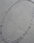 Three separate thin chain belly chains. Small bead and teardrop embellishments. Adjustable lobster clasp closures.
layered silver belly chain