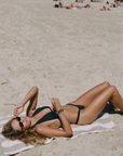 Crafted from sustainable Brazilian swim fabric
Skimpy coverage
Ruched scrunch band
black bikini bottom