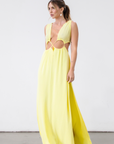 Crinkle woven sleeveless maxi dress. Waist cut outs. Side slits. Back tie closure. Back drawstring waist closure. Partially lined. vacation dress. beach dress. yellow maxi dress.