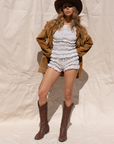 white Smocked floral printed shorts
Faux front bow
Elastic waistband
Has stretch
Unlined
summer shorts
stagecoach outfit