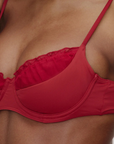 red Underwire bikini top
Ruffle neckline
Adjustable shoulder straps and back ties
Chiffon fabric over bust