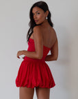 Sleeveless dress. Knit bodice. Woven bubble skirt. Elastic hem. Fully lined. red bubble dress. red mini dress. red mini bubble dress. summer dress. going out dress