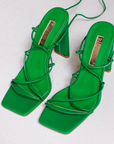 Vegan leather green lace up heel. Open square toe.
high shaved block heel
open square toe
thin flat toe strap
crossover over strappy upper
wrap around lace up ankle strap
exposed heel counter
synthetic upper, lining and outsole
Heel height 10.5cm.