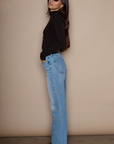 Super high rise straight leg jeans button and zipper fly. Five pocket construction. medium wash denim jeans. light wash denim jeans