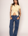 Knit button down short sleeve top
Button down closure
Open bottom hem line
Unlined
yellow top with front cut out