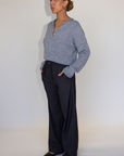 Grey woven trouser pants. Button and zipper fly. Side pockets. Faux back pocket. Unlined. Grey work slack