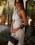 cream One shoulder linen top
Asymmetrical hem
Cinchable side
Zipper closure
resort outfit