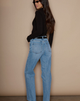Super high rise straight leg jeans button and zipper fly. Five pocket construction. medium wash denim jeans. light wash denim jeans