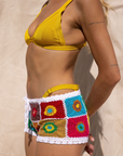 Hand crocheted micro mini shorts
Multicolor floral patchwork design
Drawstring waist