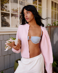 pink Fuzzy knit cardigan
Crewneck
Front button down closures
Long sleeves
Unlined
Length: 21"
Recycled Polyester/Wool/Acrylic/Spandex