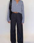 Grey woven trouser pants. Button and zipper fly. Side pockets. Faux back pocket. Unlined. Grey work slack