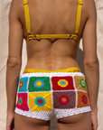Hand crocheted micro mini shorts
Multicolor floral patchwork design
Drawstring waist