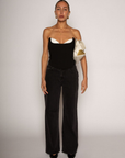 Color blocked woven bustier. Strapless neckline with inner rubber grip lining. Boning in bodice. Back hook and eye and zipper closures. Fully lined. black corset. going out top