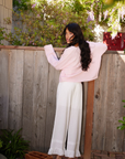 pink Fuzzy knit cardigan
Crewneck
Front button down closures
Long sleeves
Unlined
Length: 21"
Recycled Polyester/Wool/Acrylic/Spandex