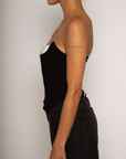 Color blocked woven bustier. Strapless neckline with inner rubber grip lining. Boning in bodice. Back hook and eye and zipper closures. Fully lined. black corset. going out top