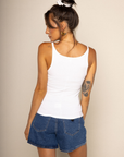 Baby ribbed tank top
Scoop neck
Sleeveless
Fitted
Fixed straps
Midweight
white tank top