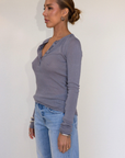 grey Ribbed knit top
Henley neckline with button closure
Long sleeves
Unlined