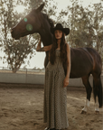 Plaid woven maxi dress. Elastic strapless neckline. Inner rubber grip lining. Elastic smocked back panel. Back hook and eye and zipper closures. Fully lined. Paid maxi dress. ranch outfit. western outfit